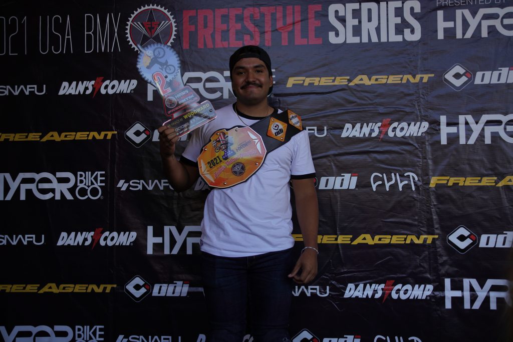 Free Agent rider Dante Tabuyo with his second place trophy from the final contest of the USA BMX Freestyle tour, that gave him the push in points to win the 2021 National amateur championship and receive the championship belt.